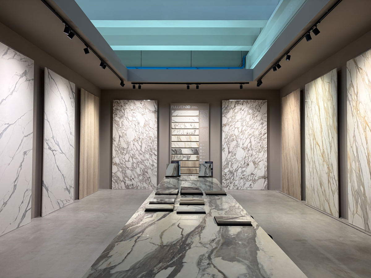 Large slabs and material samples displayed at the ABK Group Studio showroom in Fiorano Modenese