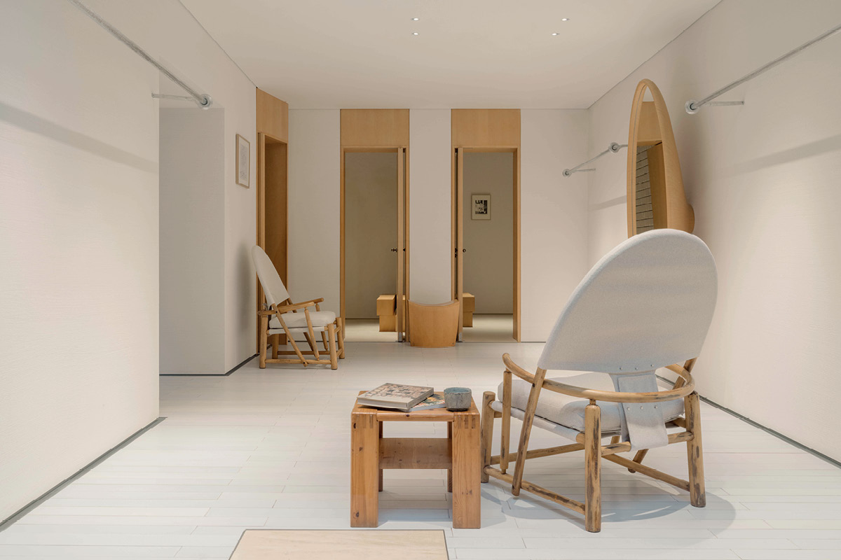 YOUWEI Xinle Road retail space with wooden furniture and integrated clothes rails