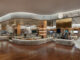 Vista panoramica di Le Gourmet al The Chanakya Mall di New Delhi, con banchi curvi e aree espositive alimentari.