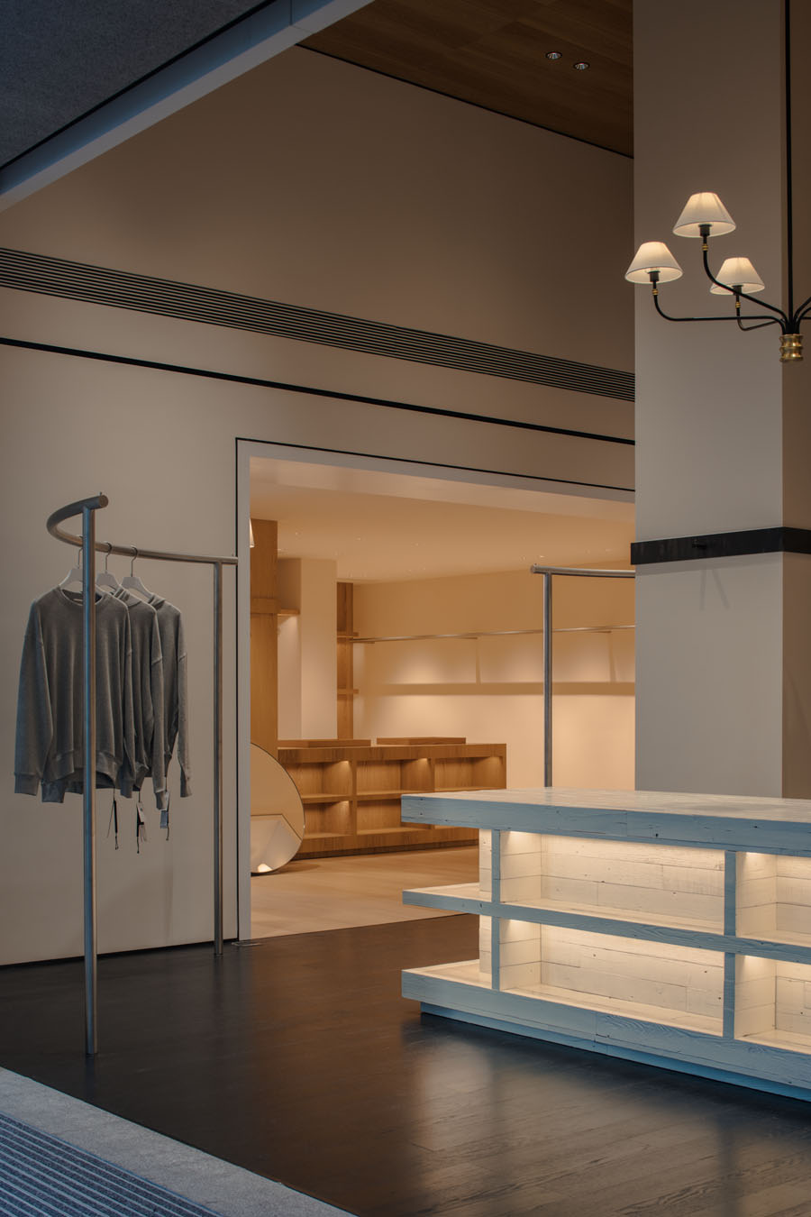 Clothing rails and lighting inside the nice rice Upper Hills concept store